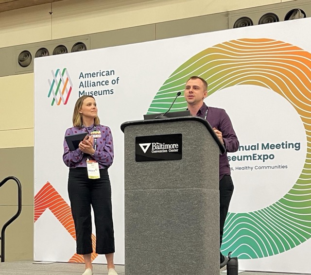 Two Amuse team members presenting on stage at the American Alliance of Museums annual meeting in Baltimore.